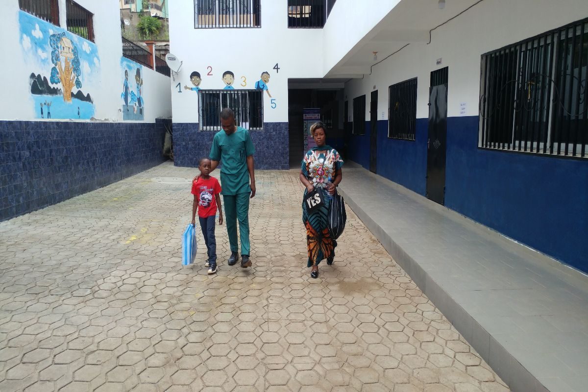 Head teacher accompany parent after registration